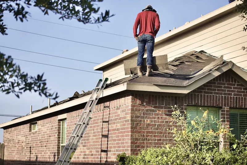 Professional roofer working on a residential roof in Chevy Chase Heights
